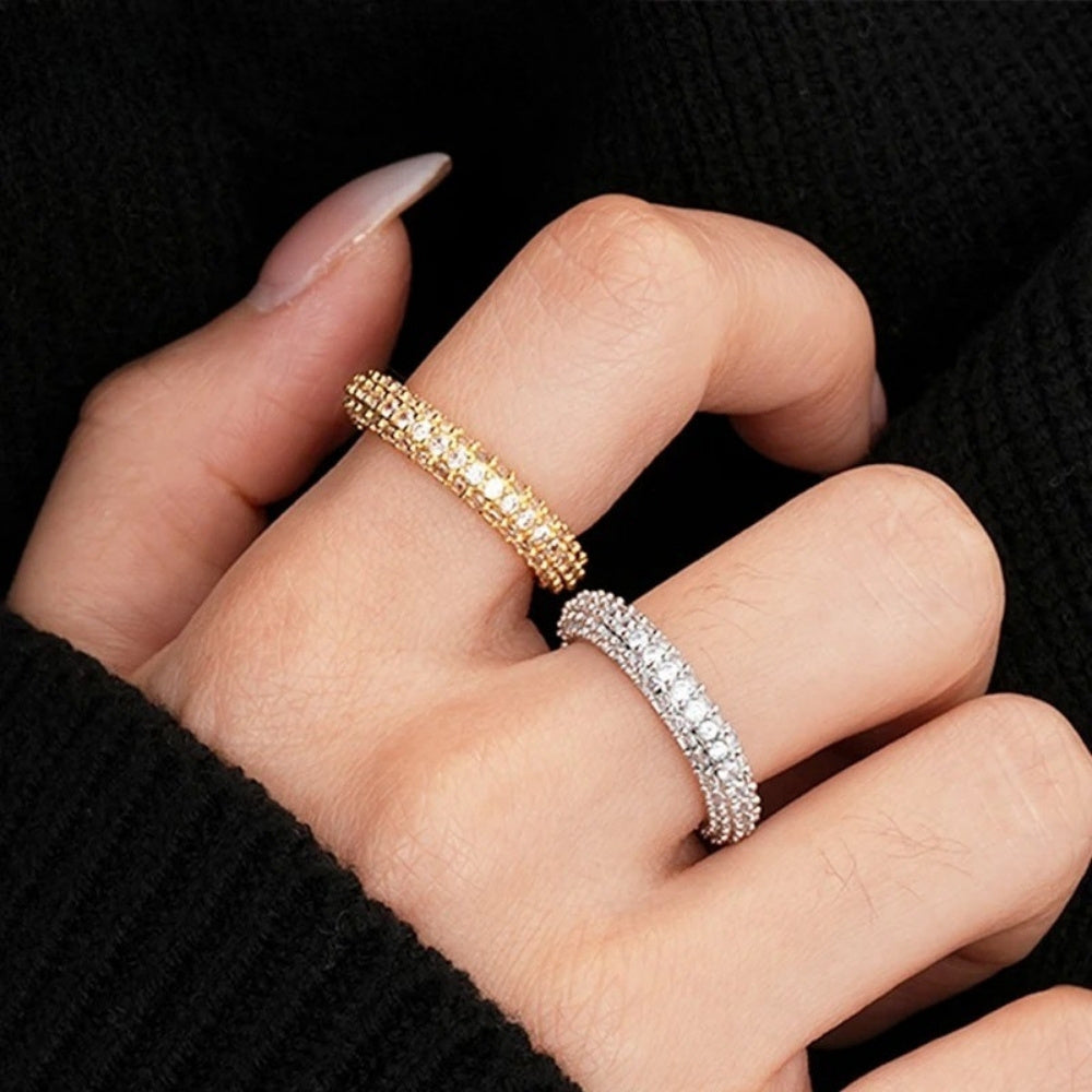 18k Gold Plated Full Moissanite Ring - Hand wearing two rings, one gold and one silver, on a black background