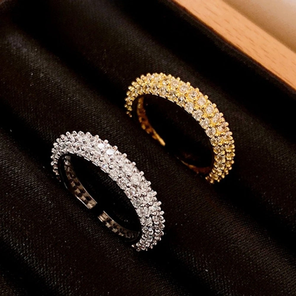 18k Gold Plated Full Moissanite Ring for Women - Two diamond-encrusted rings, one gold and one silver, on a black velvet surface.